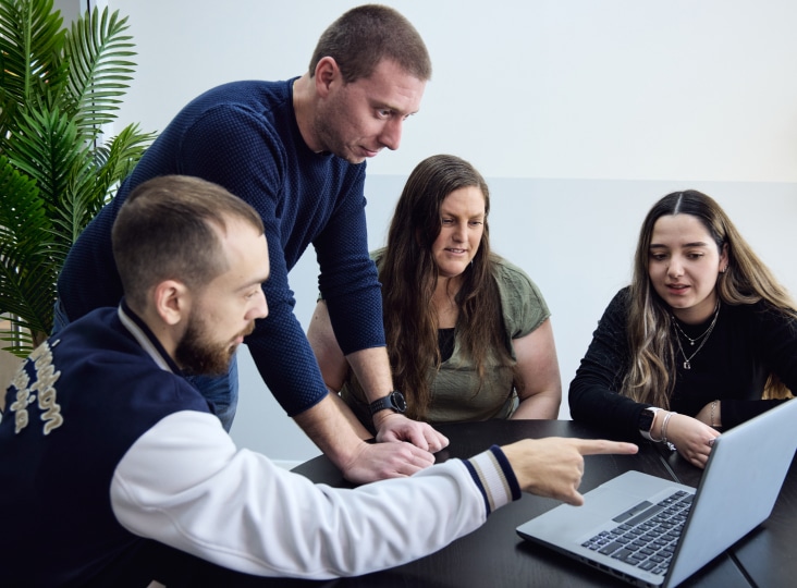 Four Morphisec employees working together