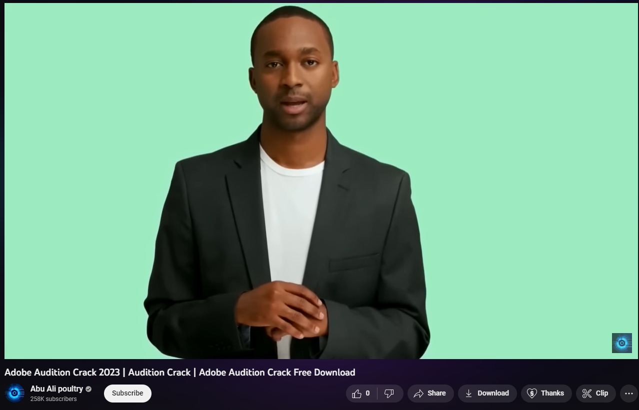 Man in front of a green screen during a YouTube video about cracking Adobe Audition